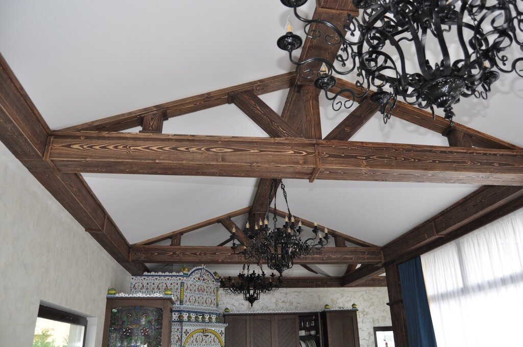 Decorative ceiling beam with a wood finish