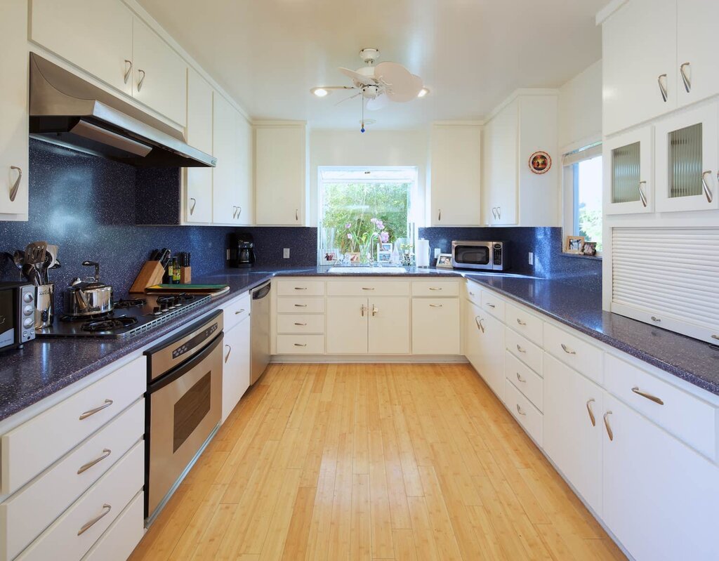 Beige kitchen with a black countertop