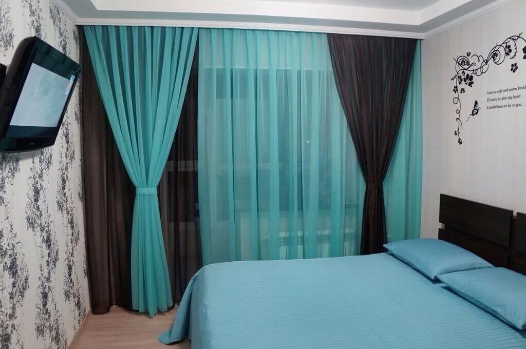 Turquoise curtains in the bedroom