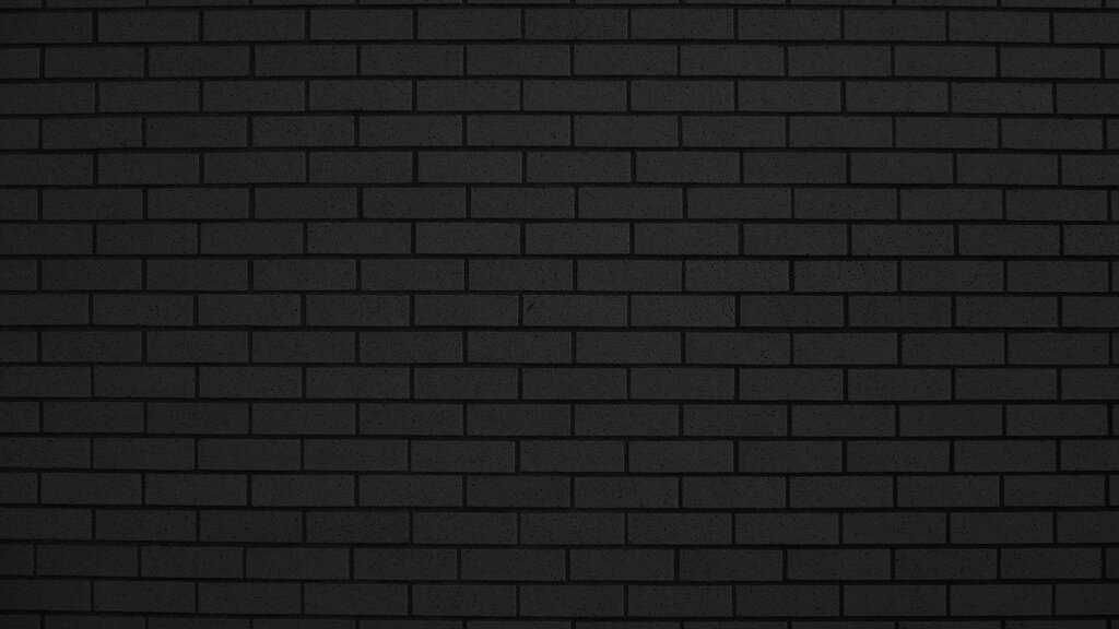 Черная кирпичная стена фон