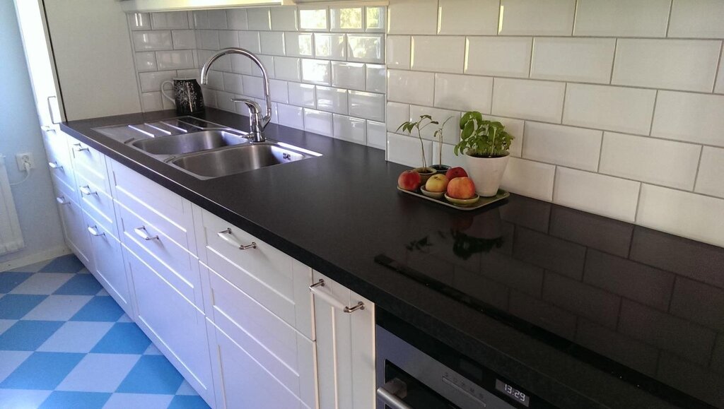 Black countertop, white backsplash