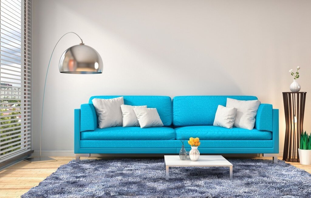 A sofa of blue-green color