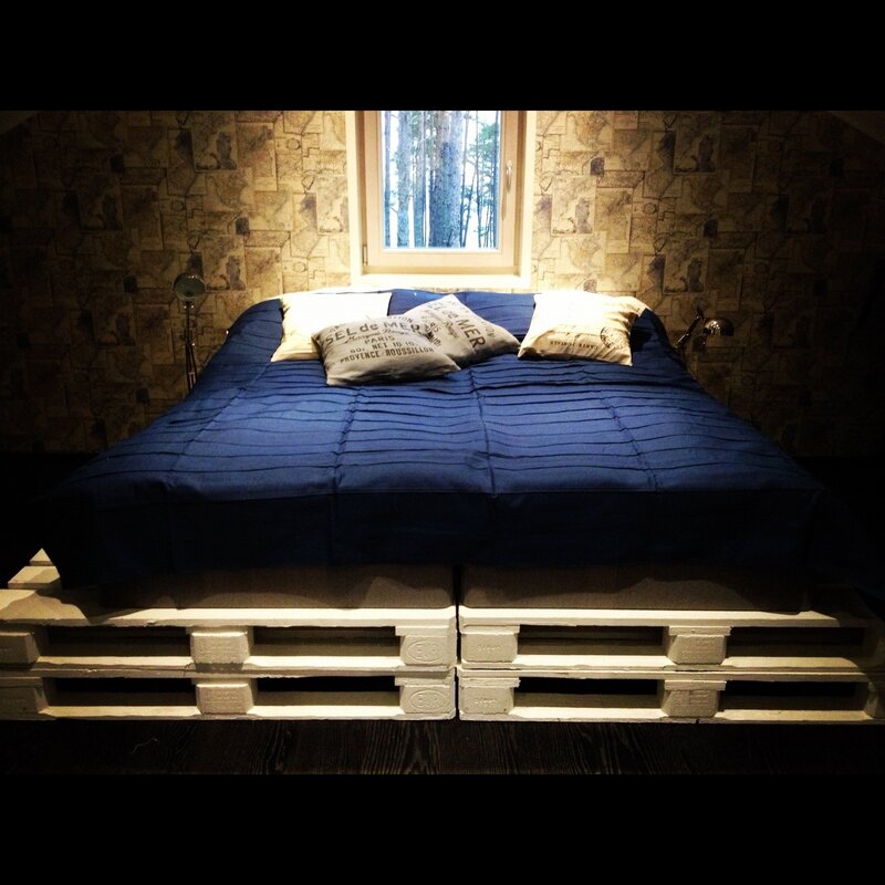 A double bed made from pallets