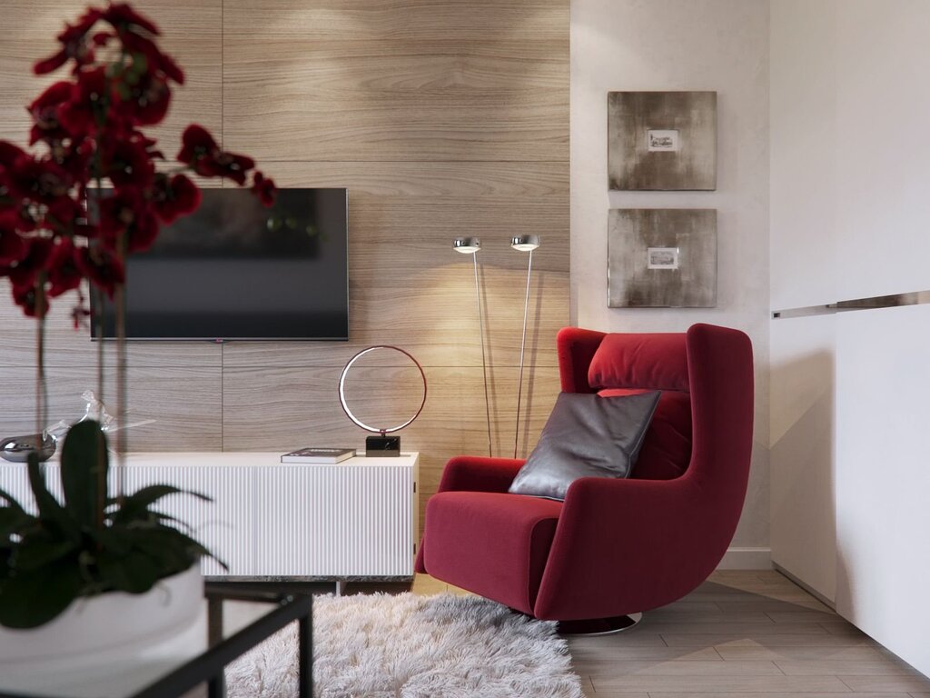 The living room with the red armchair