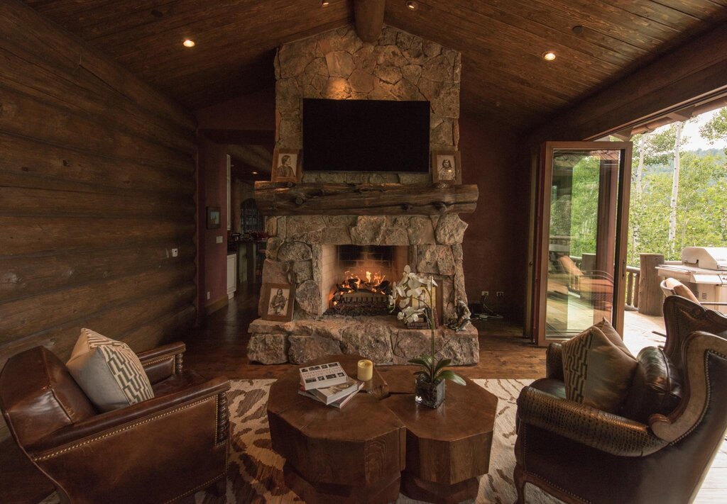 A fireplace in a log cabin