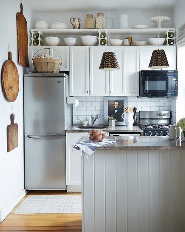 A refrigerator in a small kitchen