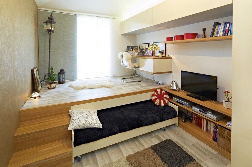 A room with a platform for a bed