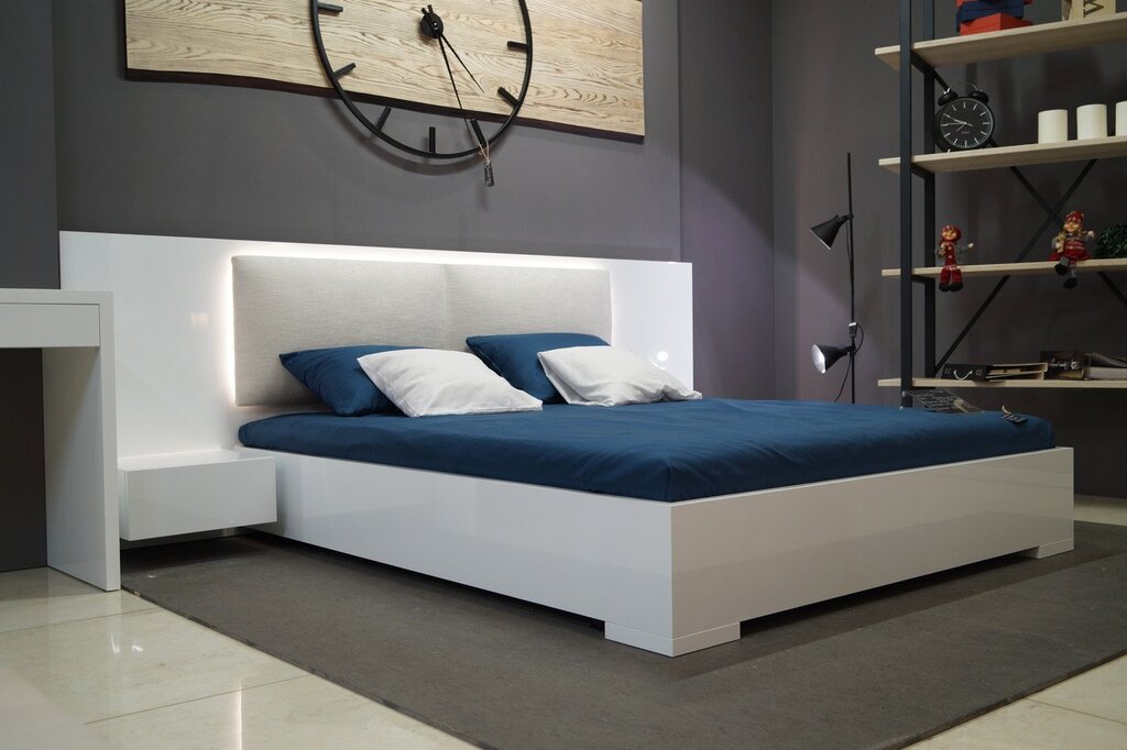 Bed with a soft headboard and nightstands