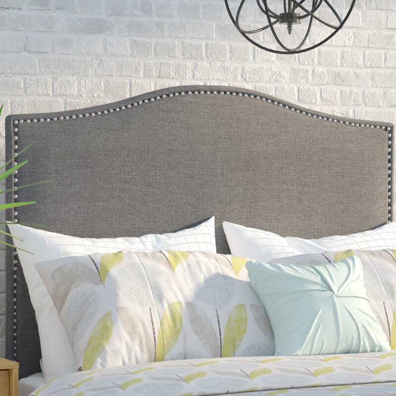 Bed with a fabric headboard