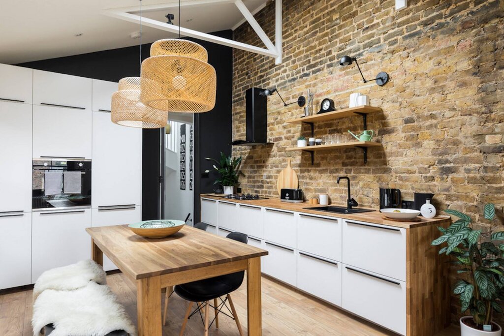 A kitchen without wall cabinets in a loft style