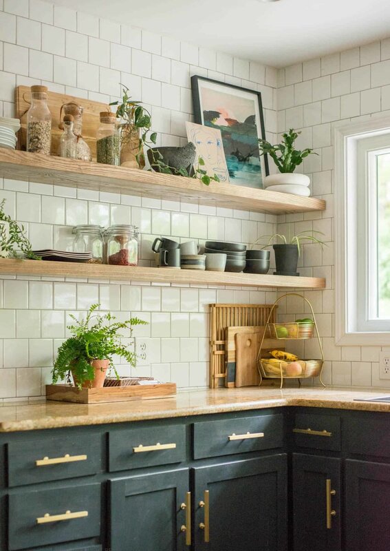 A kitchen with shelves instead of wall cabinets