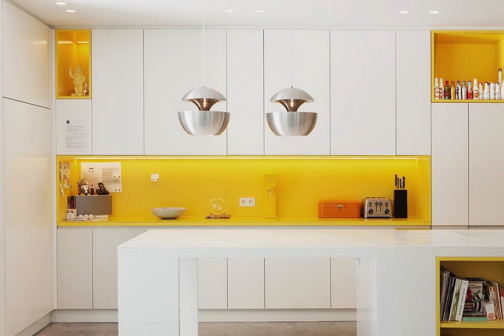 A kitchen in yellow tones