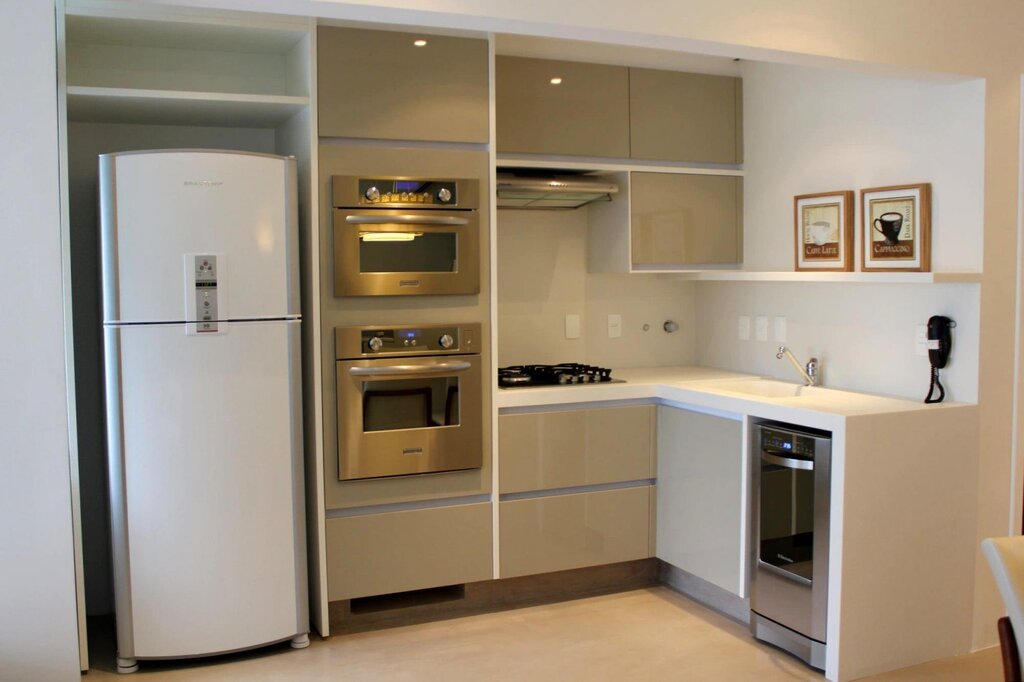 Small corner kitchen with a refrigerator