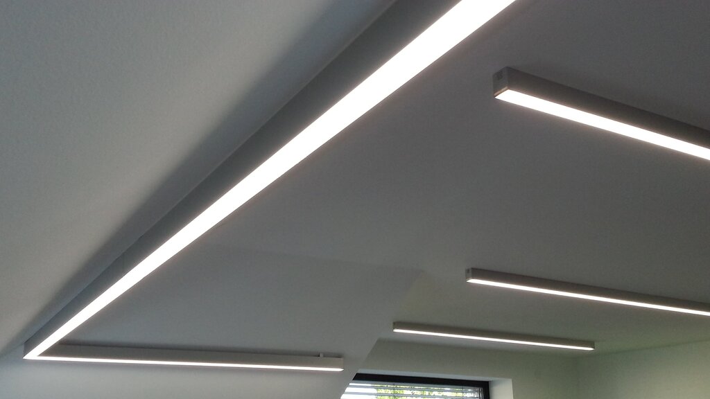 Overhead linear lighting fixtures in the interior