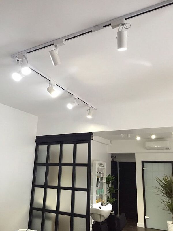 Surface-mounted lights on a stretch ceiling