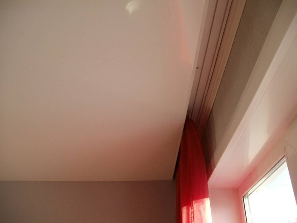 Plastic cornice on a stretch ceiling