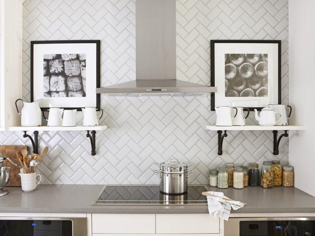 Subway tile on the backsplash in a herringbone pattern