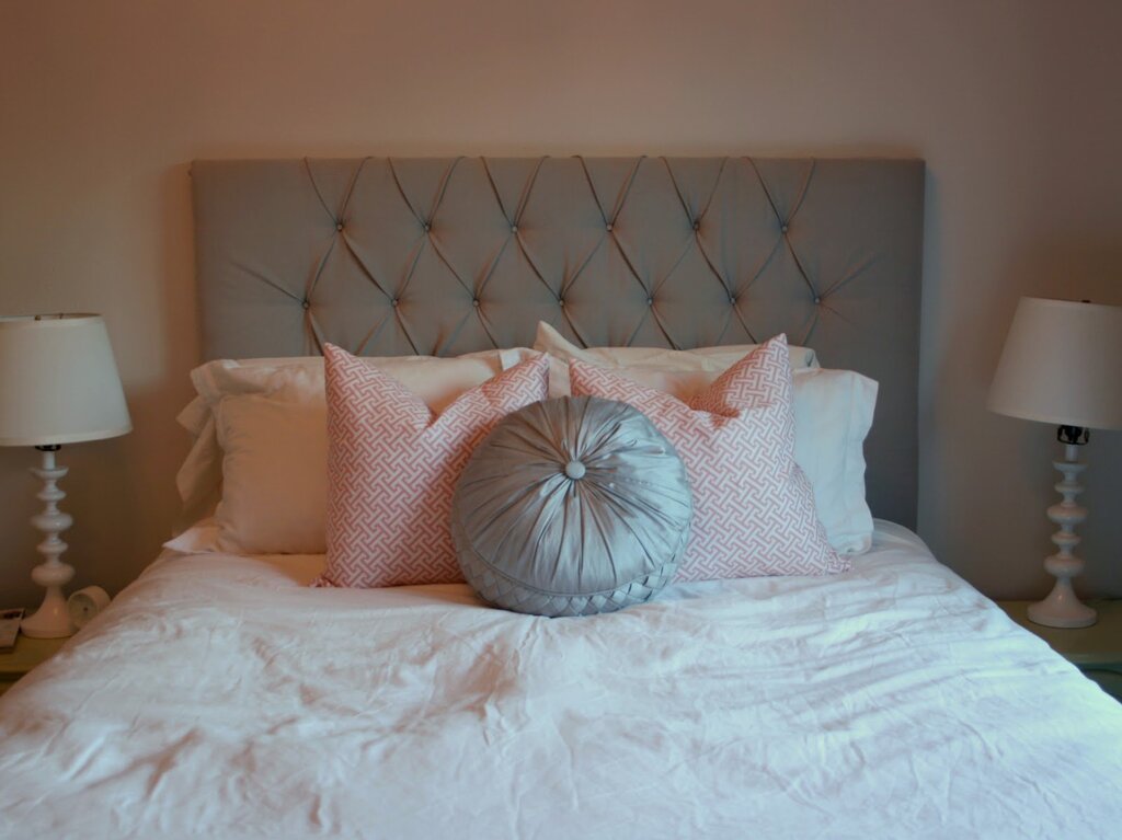 Pillows on the wall by the bed