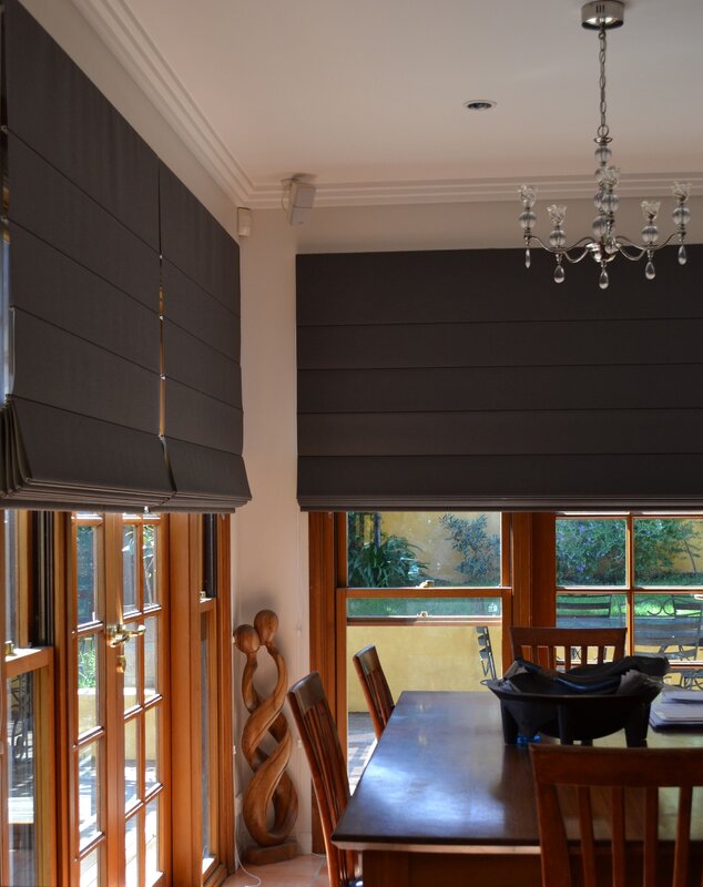 Roman shades in a wooden house