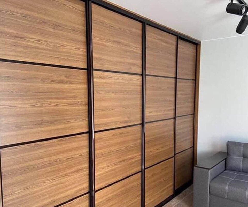 Wardrobe with sliding doors made to look like wood