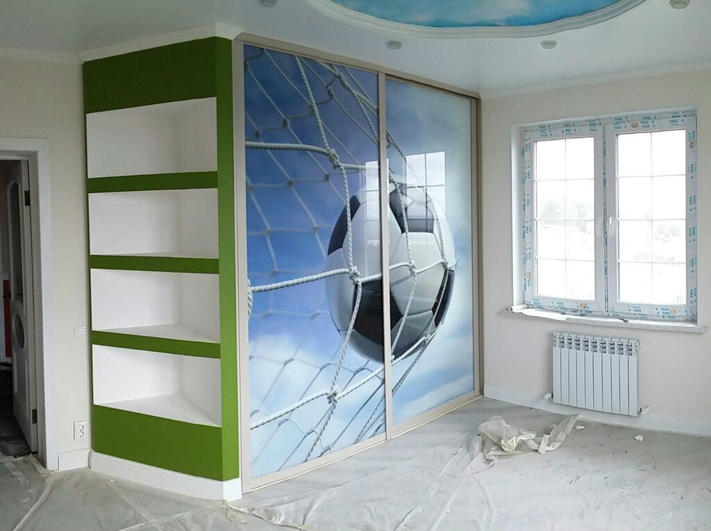 A wardrobe with sliding doors for a teenage boy's room