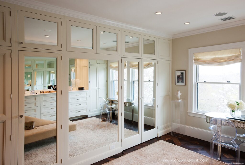 A wardrobe with mirrored doors