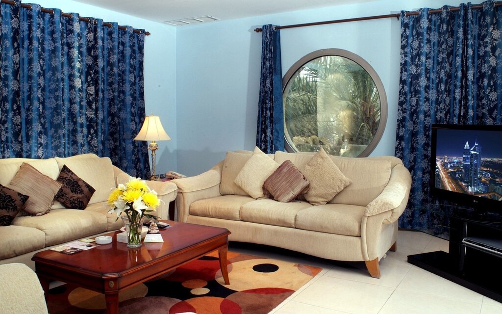 Blue sofa and blue curtains