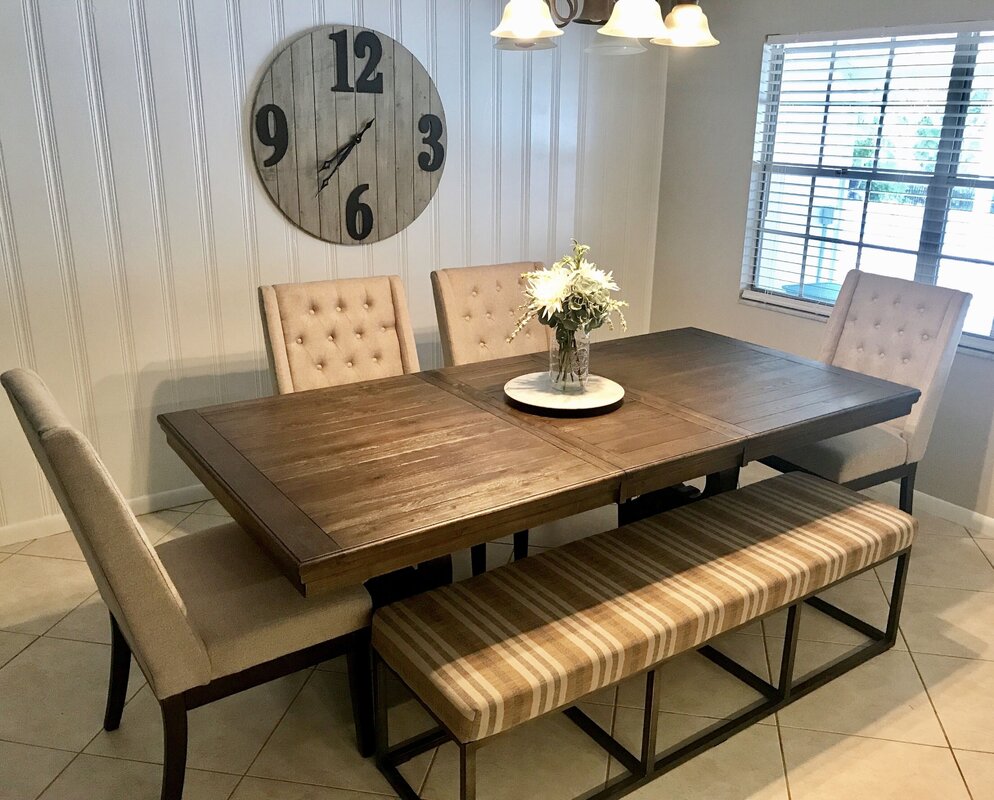 A table against the wall in the kitchen