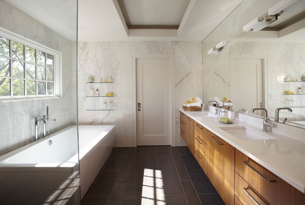 A bright bathroom with a dark floor