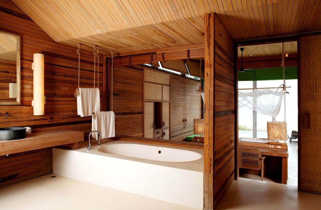 A bathtub with wooden elements