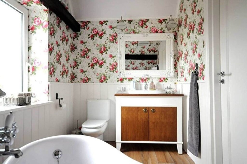 A bathroom with wallpaper and tiles