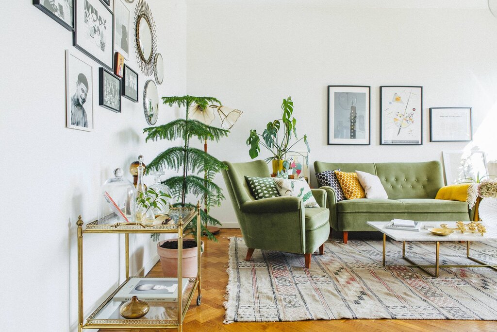 Green sofa in Scandinavian interior